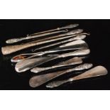 Five assorted hallmarked silver handled shoe horns, together with five silver handled button hooks,