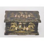 A 19th Century laquered papier mache tea caddy inlaid with mother of pearl figures in garden scenes,