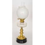 An late 19th Century brass and clear glass oil lamp,