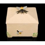 A 1930s Crown Devon square honey box with honeycomb decoration and a bee knop, printed mark,