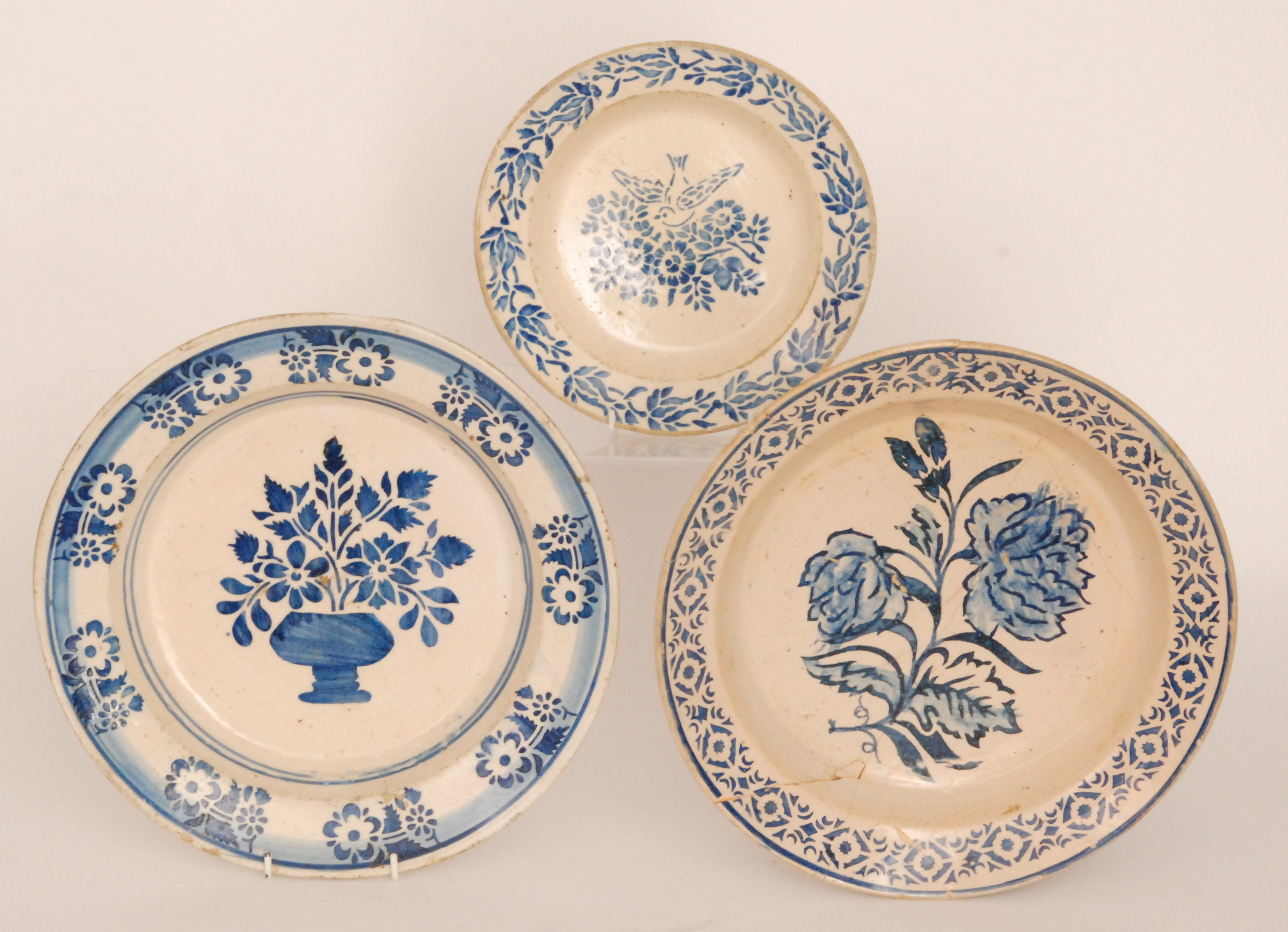 Three late 19th to early 20th Century continental tin glazed chargers each decorated in blue and