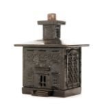 A 19th Century cast iron black painted money box modelled as a bank, height 15cm.