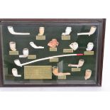 A framed and glazed collection of fifteen assorted clay pipe bowls predominately from Broseley,