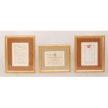 A collection of early 20th Century framed menus and invitations,