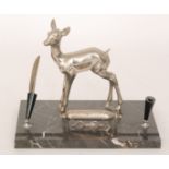 A 20th Century French Art Deco style desk stand modelled as a fawn with calendar and pen stands on