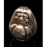 A Sterling silver pepperette modelled as a seated Inuit wrapped in a blanket, height 5cm. S/D.