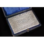 A Victorian hallmarked silver rectangular aide-memoire with engraved foliate scrolls and floral