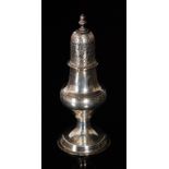 A George III hallmarked silver castor of plain baluster form terminating in acorn finial,