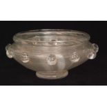 A late 19th Century Stevens & Williams clear crystal bowl of footed circular form with folded rim,
