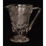 A later 20th Century Tudor crystal cut glass jug of footed conical form with applied angular handle,