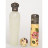 A late 19th Century white metal mounted glass scent bottle,