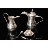 An Egyptian silver coffee service comprising coffee pot, cream jug, six coffee cups and saucers,