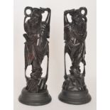 A pair of early 20th Century Oriental Export carved hardwood figures of dancing bearded gentlemen,