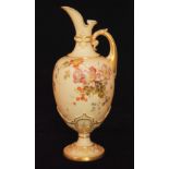 A late 19th Century Royal Worcester blush ivory footed ewer decorated with dog roses,