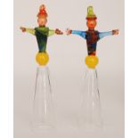 A pair of later 20th Century studio glass novelty champagne goblets modelled as stylised dancing