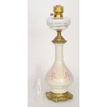 A late 19th Century brass and glass oil lamp,