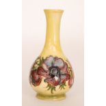A Moorcroft vase decorated in the Anemone pattern against a yellow ground, impressed marks,