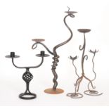 A 20th Century wrought iron twin branch candelabra, height 64cm together with a similar example,