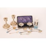 A pair of George V hallmarked silver shell form salts in fitted case, a pair of dwarf candlesticks,