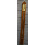An early 19th Century stick barometer in dome topped mahogany cross-banded case,