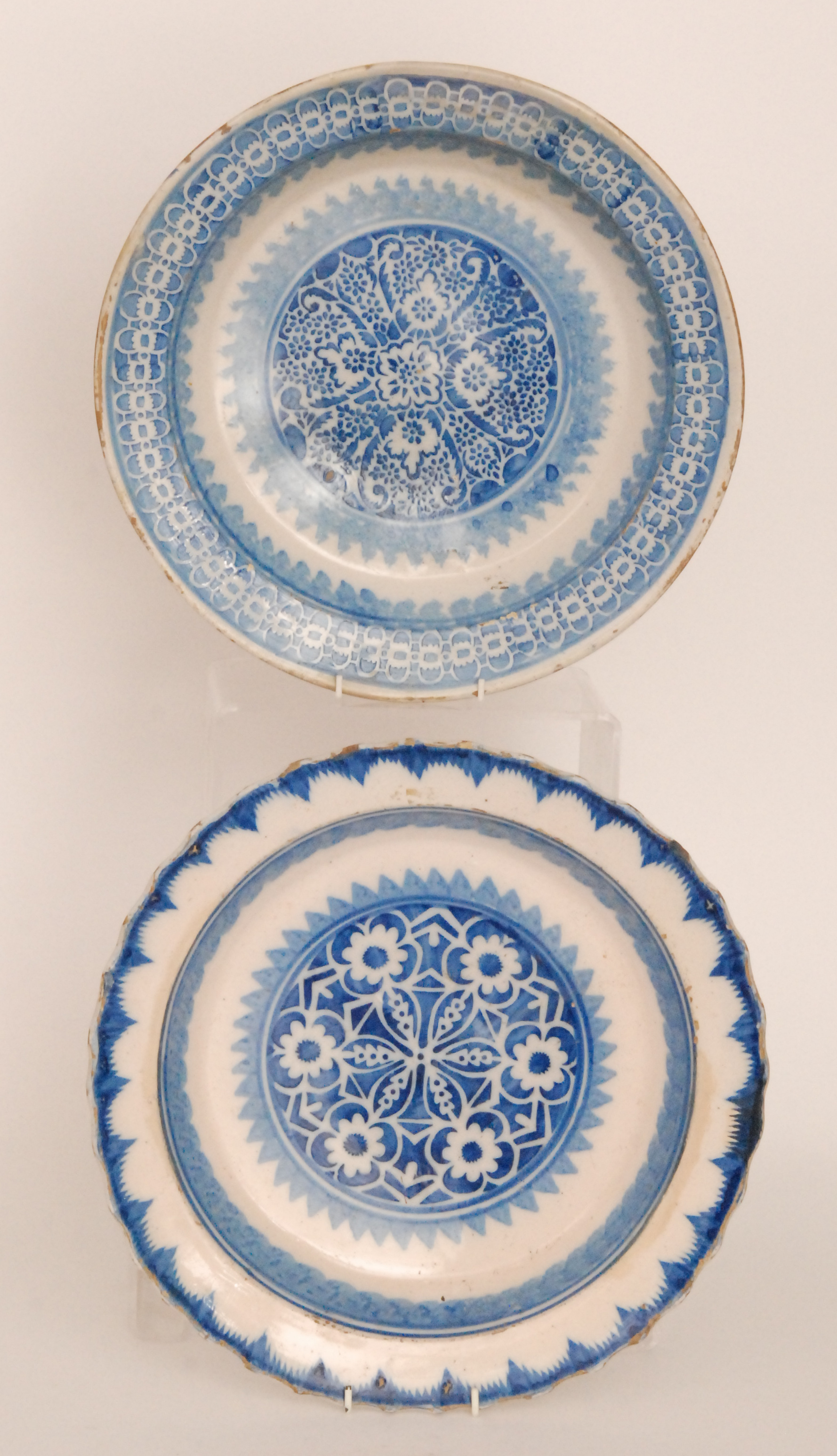 Two late 19th to early 20th Century continental tin glazed chargers both decorated in blue and