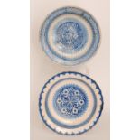 Two late 19th to early 20th Century continental tin glazed chargers both decorated in blue and