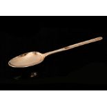 A George II hallmarked silver shell back table spoon and marrow scoop, Old English pattern,