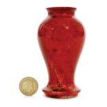 A miniature Moorcroft vase of inverted baluster form decorated in a tonal red flambe glaze,