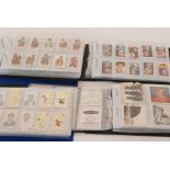 A collection of cigarette cards contained in seven albums to include various sets and part sets,