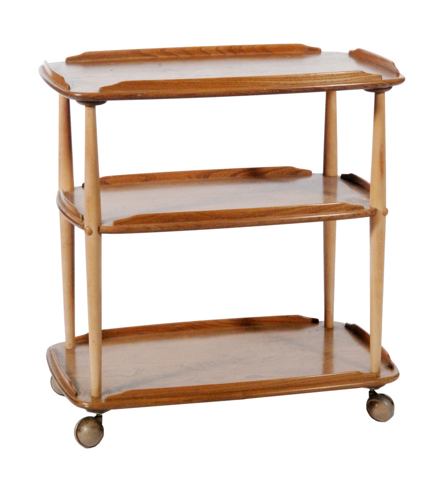 Ercol Furniture - A light elm and beech three tier serving trolley, bears paper label,