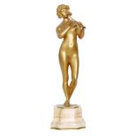 After Rene Marquet - A gilt bronze study of a female nude playing a flute,