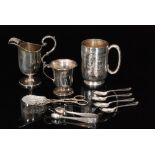 An early 20th Century half pint christening tankard with foliate engraved decoration to whole