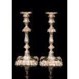 A pair of modern cast silver candlesticks in the Georgian taste,