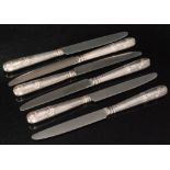 A set of six hallmarked silver handles dinner knives with shell and reed handles,