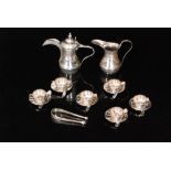 An Egyptian silver coffee service comprising coffee pot, cream jug, six coffee cups and saucers,