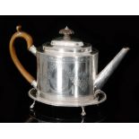 A George III hallmarked silver tea pot and stand,