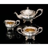 An early 20th Century American Sterling silver three piece tea service composed of teapot,