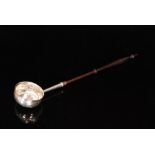 A George I hallmarked Britannia silver toddy ladle of plain circular form terminating in later