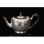 A Victorian hallmarked silver bachelor's tea pot with part fluted decoration, weight 9.