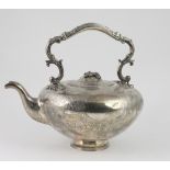 A large bulbous shaped Victorian English silver Kettle, with engraved and embossed decoration,