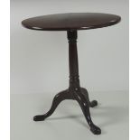 A small 19th Century circular mahogany Occasional Table, on a tripod base with pad feet,