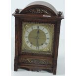 An attractive 19th Century brass mounted oak cased Mantle Clock, with silvered and brass dial.