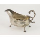 A rare early 19th Century plain Irish Provincial silver Sauceboat, with reeded rim, scroll handle,