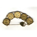 Gold: A 9ct gold Sovereign Bracelet, with five full Sovereigns for 1879, 1899, 1900, 1907 & 1963,