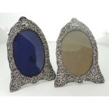 A pair of late 19th Century English silver shield shaped Photo Frames, decorated with scrolls,