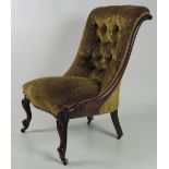 A good early Victorian carved rosewood Low Chair or Nursery Chair, with deep buttoned back,