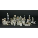 An unusually large collection of approx. 30 varied silver mounted cutglass Scent Bottles, jars etc.
