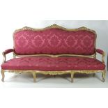 A large and imposing early 19th Century giltwood three seater Settee,