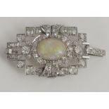 An unusual platinum Brooch/Pendant, set with opal stone, and with 58 varied small cut diamonds.