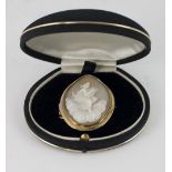 A 9ct gold framed carved oval Cameo Brooch, with heavenly figure playing a lyre,